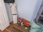 The queen bedroom closet has a pack-n-play, linens, and a few kids toys.